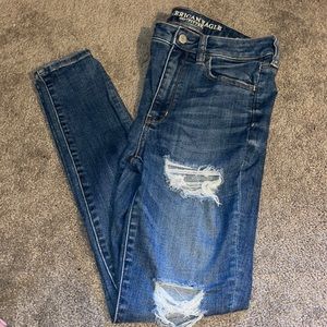 Dark wash with holes AE skinny jeans